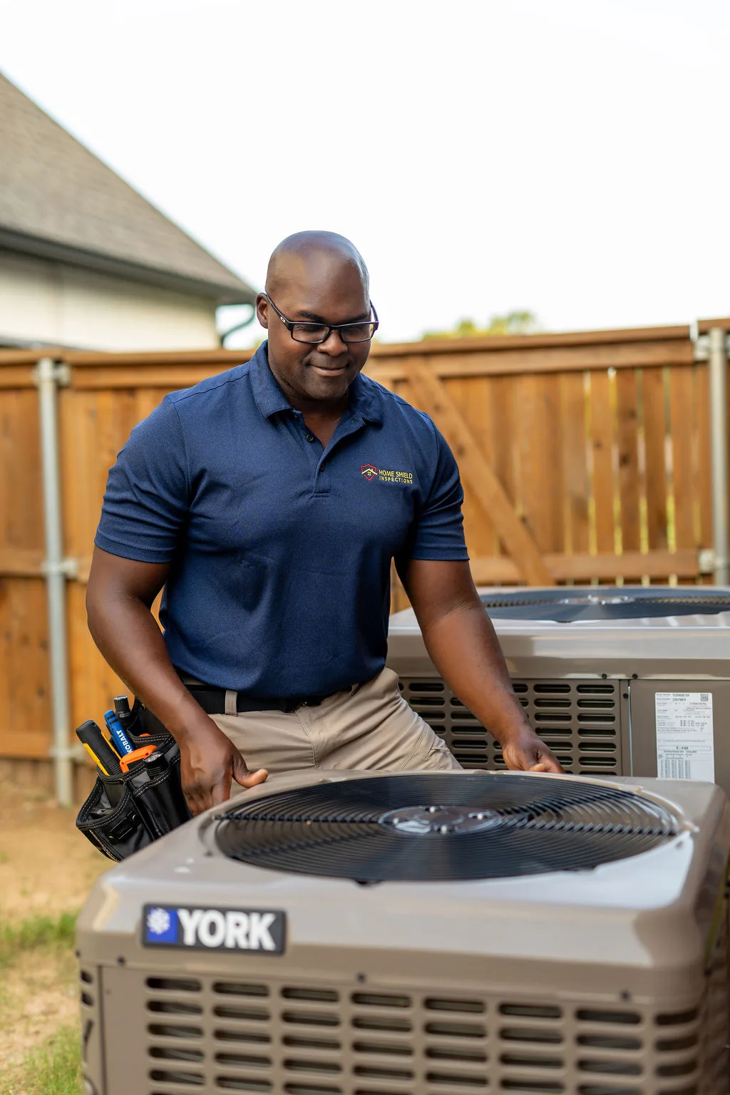 Inspecting an exterior HVAC condenser unit